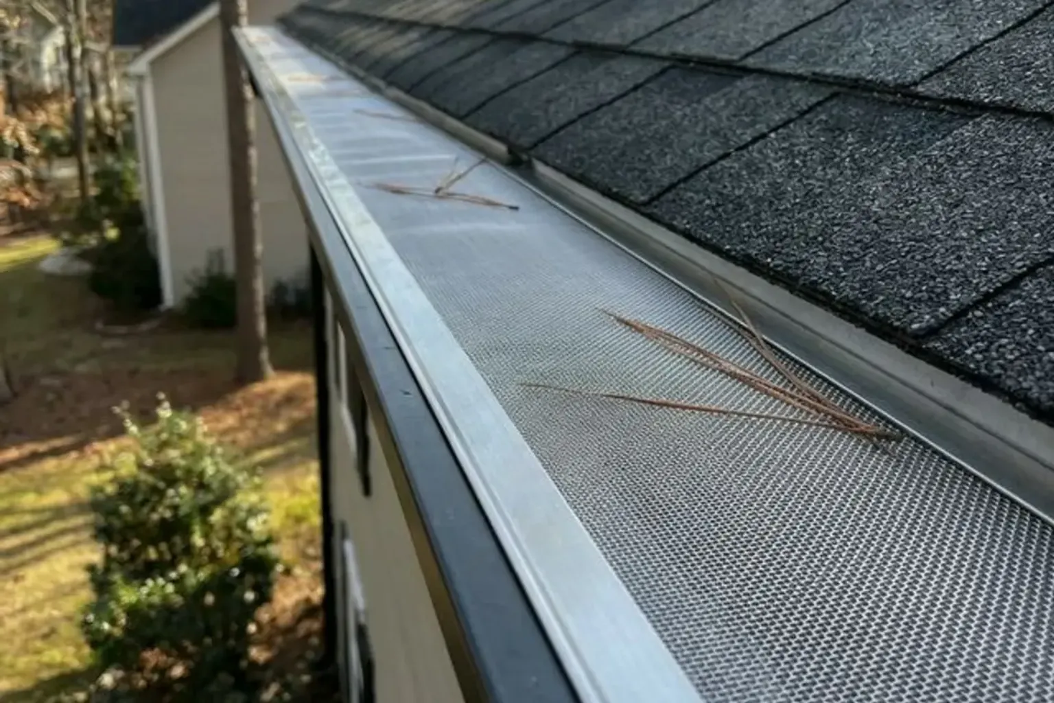 Documentary-style iPhone photo of gutter repair and resealing on a residential home in Provo, Utah. Natural lighting.
