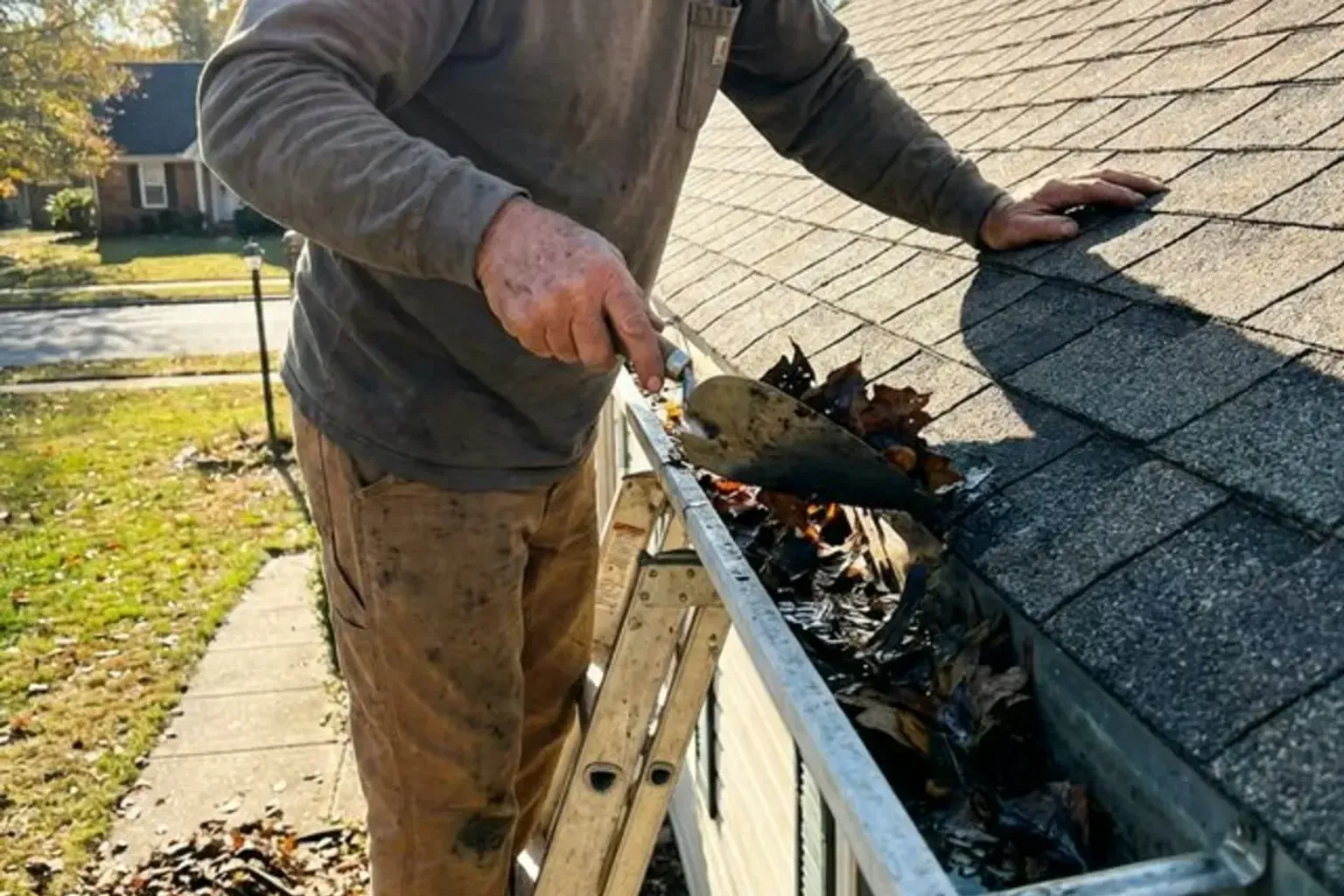 Roofing contractor performing preventive maintenance inspection on a Provo, Utah home